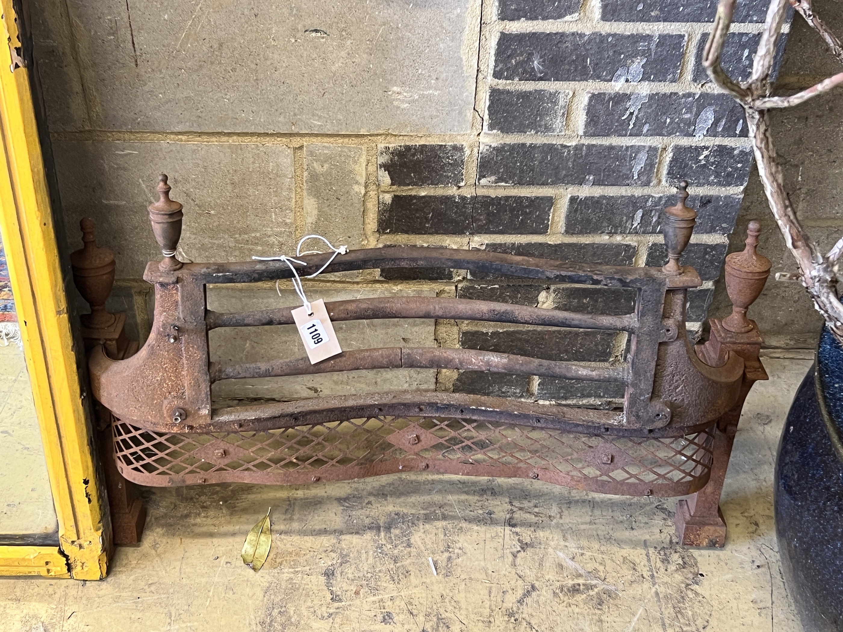 A 19th century cast iron fire grate front, width 80cm, height 59cm